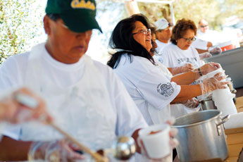 Marsha Nieto serves up soup at the Zuni Housing Fair Friday. Hundreds of people showed up for the annual event, which included drumming and singing, booths and a free lunch. © 2011 Gallup Independent / Brian Leddy